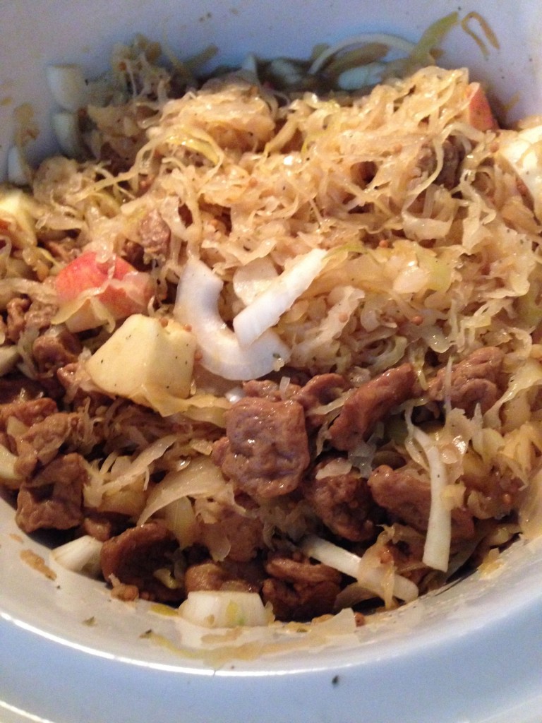 In a crockpot, mix the seitan, sauerkraut, apple pieces, onion, beer, and brown sugar. Cover and cook for at least two hours.