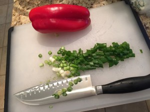 Chop your scallions and pepper.