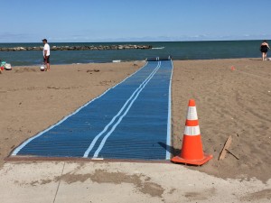 Wheelchair mat that leads to the shore.